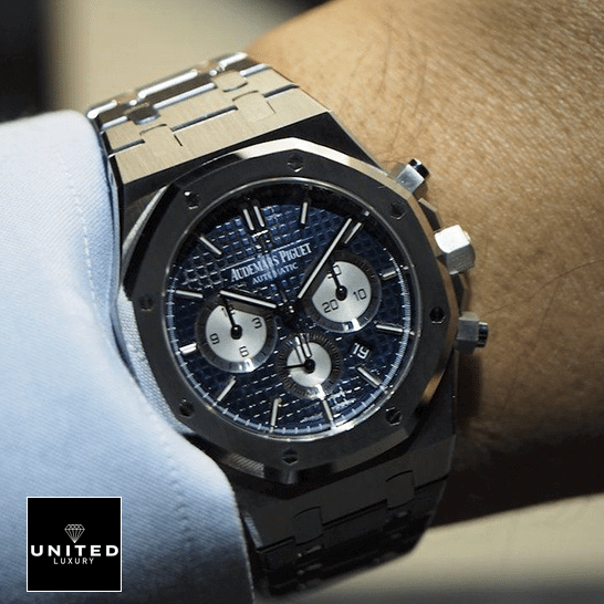 Audemars Piguet Royal Oak Blue Dial Steel Replica on the man wrist push button